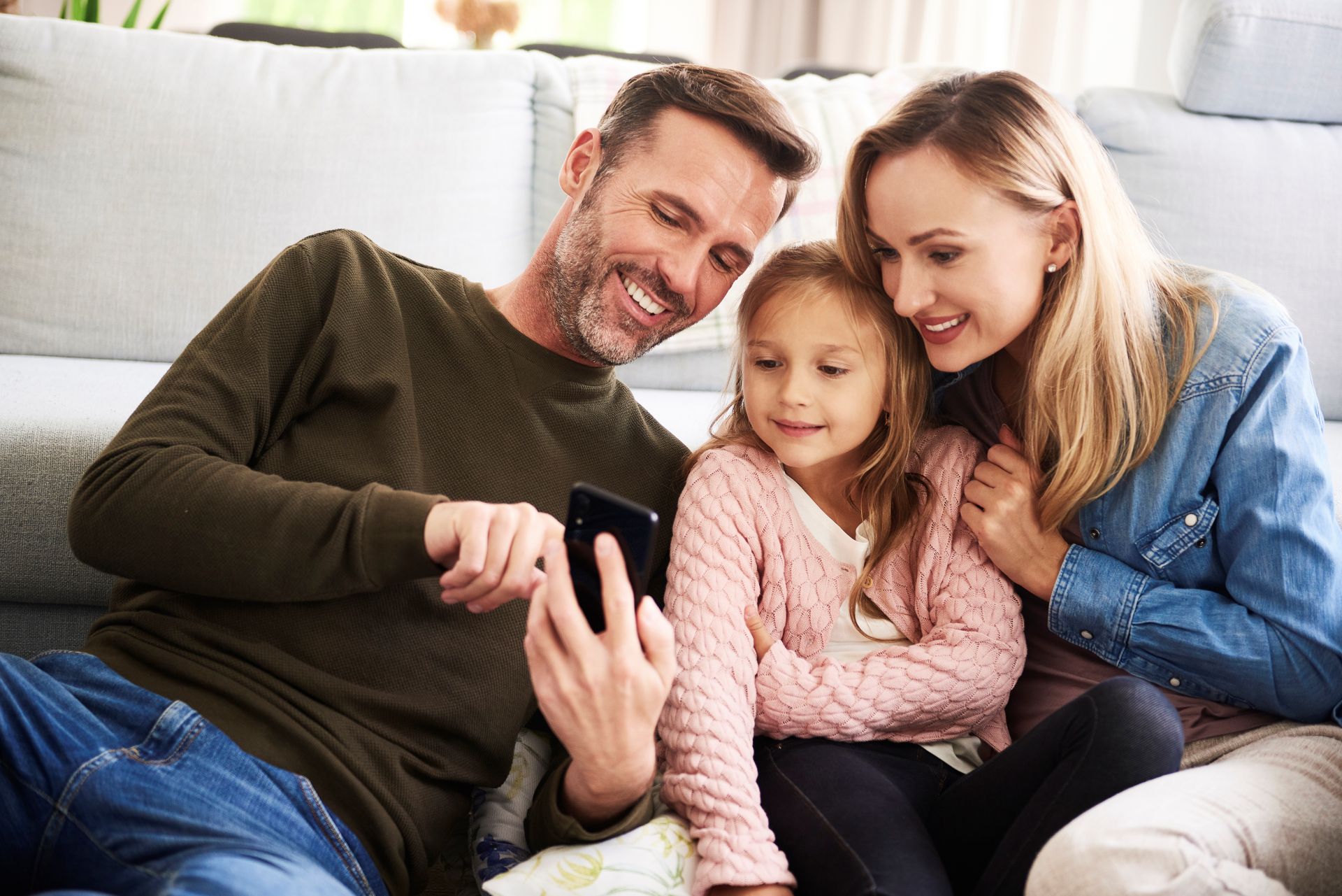 Family looking at phone