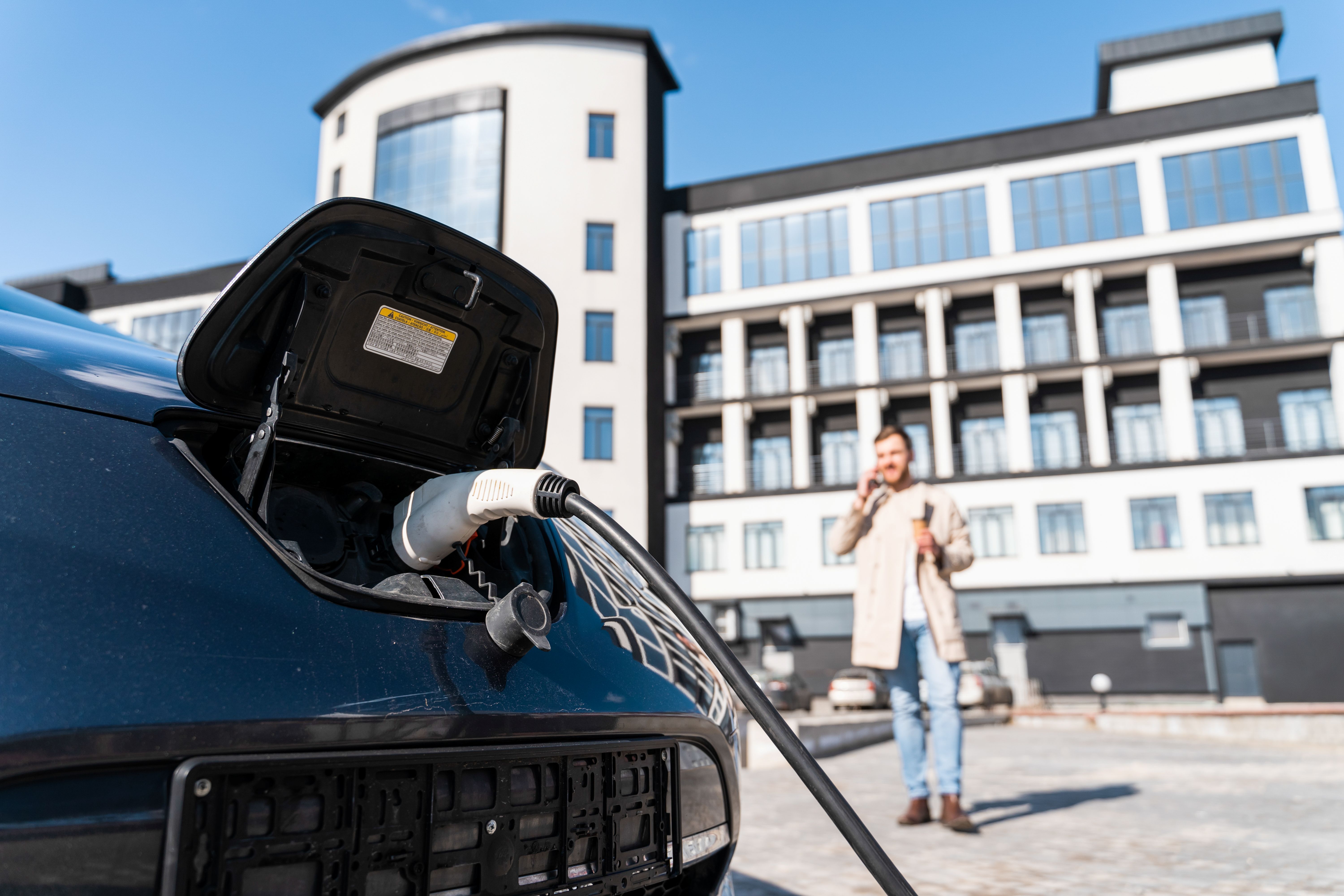 Car charging in front of multi family home
